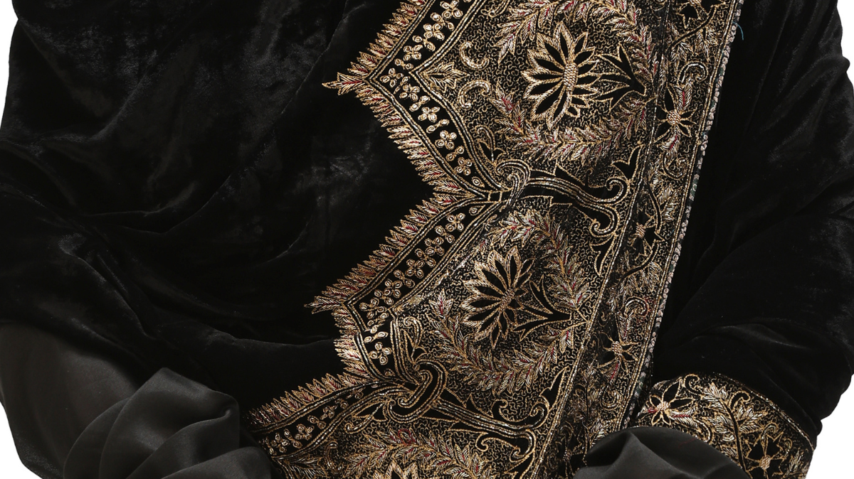 Harkiran black silk velvet dupatta with gold tilla embroidery by Mimamsaa, draped over the shoulder