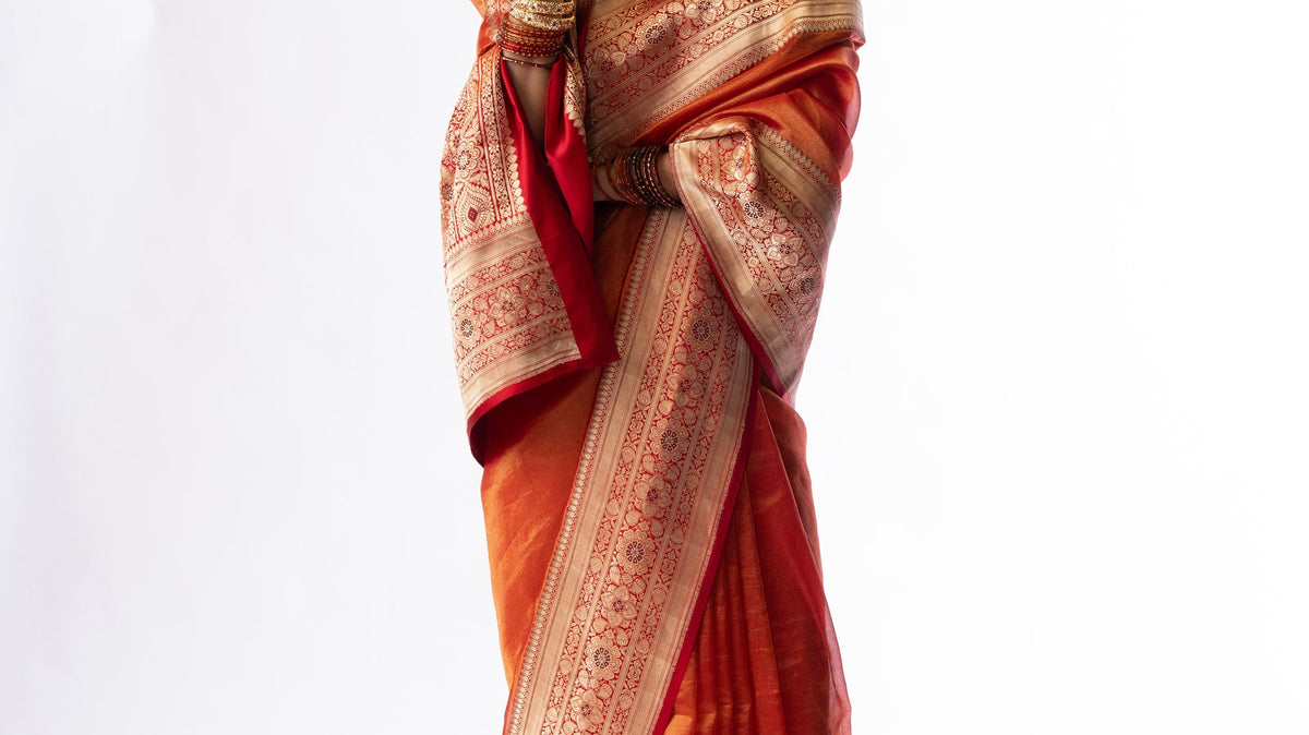 Mahi red tissue silk saree with a brocade border by Mimamsaa, styled for a festive evening