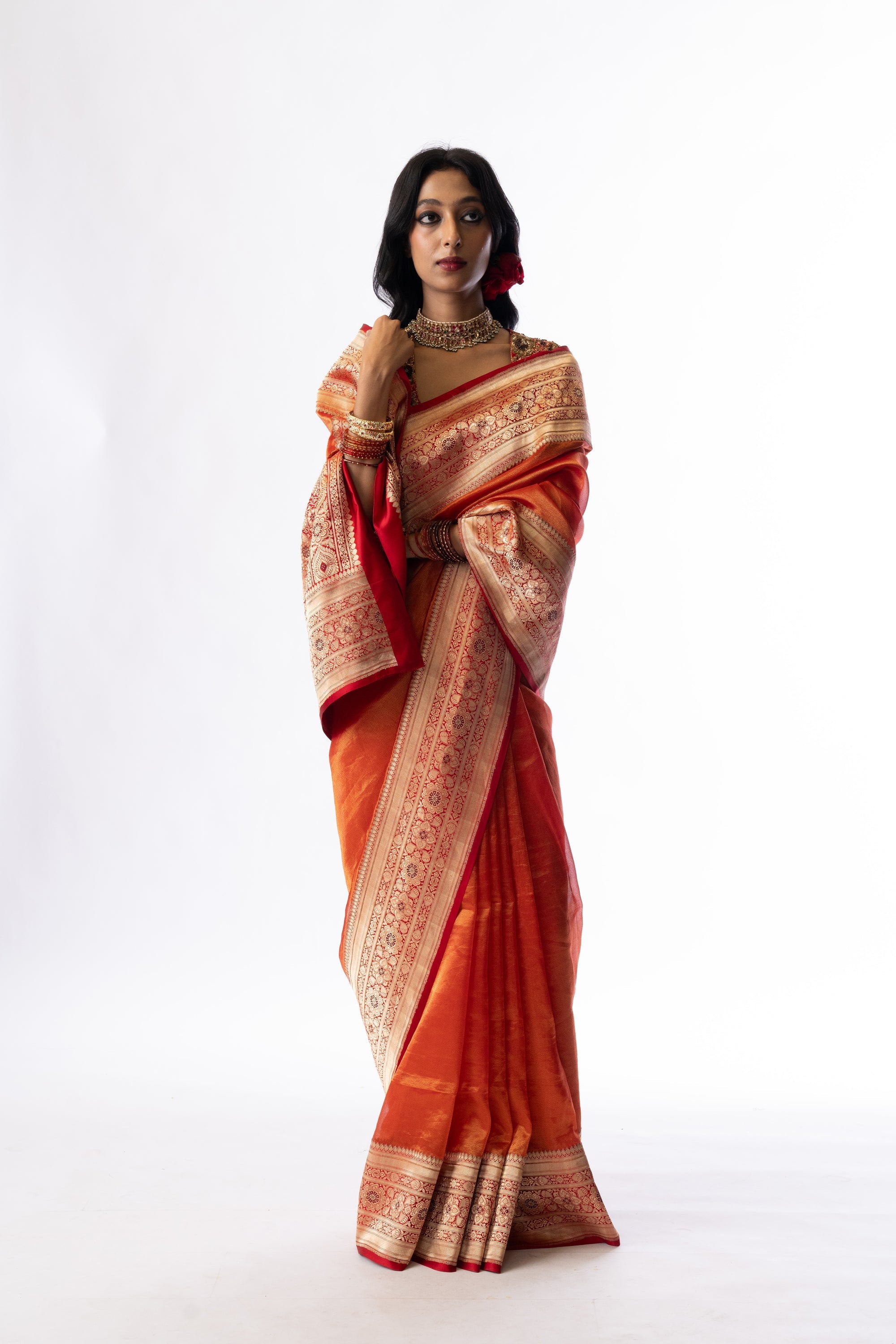 Mahi red tissue silk saree with a brocade border by Mimamsaa, styled for a festive evening